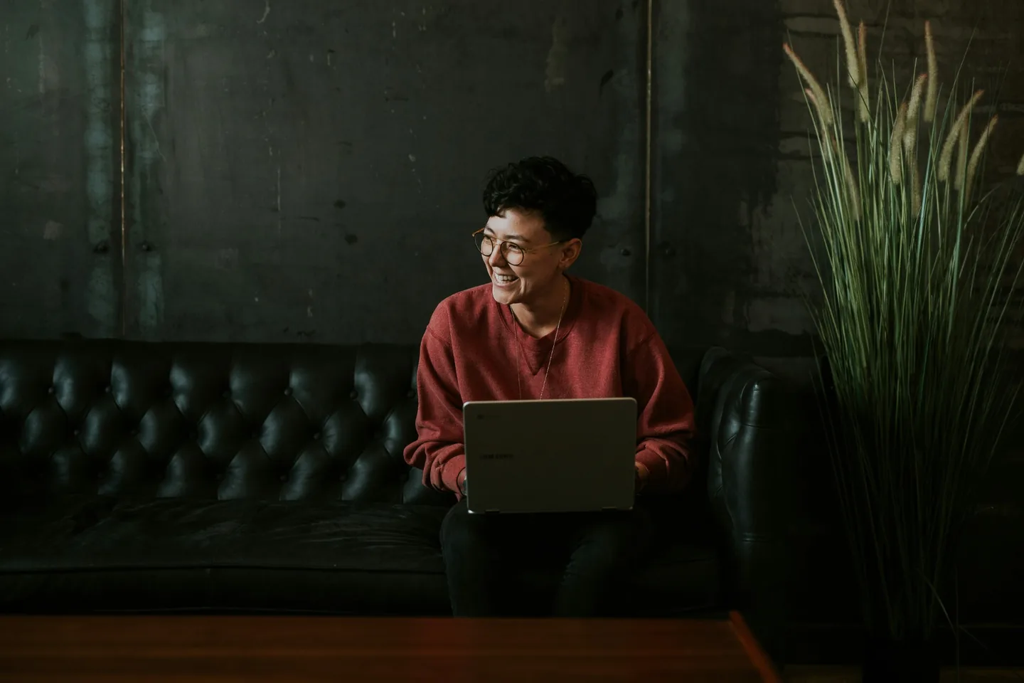 A professional working on a laptop in a quiet workspace.